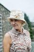 Ladies Small brim Cream Cotton Cloche Hat with Linen Knot Decoration.