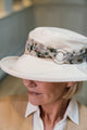 Stylish Cream Cotton Wide Brim Hat with Floral Band Finished a Wooden Buckle Ring.