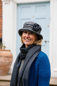 Soft Ruched Cloche Style Winter Hat Adorned With Textured Flower Trim